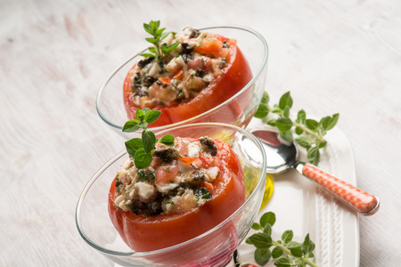 stuffed tomatoes with mozzarella black olivesの写真素材