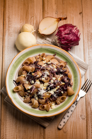 integral pasta with red chicory and scamorza cheeseの写真素材
