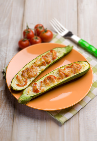 zucchinis stuffed with mozzarella and fresh tomatoes, selective focusの写真素材