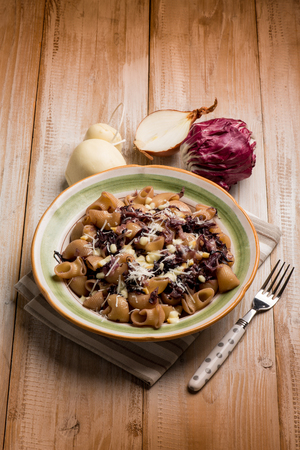 integral pasta with red chicory and scamorza cheeseの写真素材