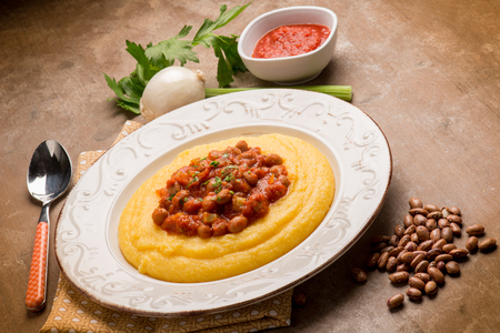 porridge with beans and tomatoes sauceの写真素材