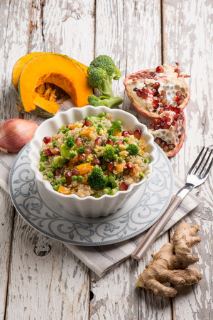 quinoa salad with mixed vegetables pomegranate and gingerの写真素材