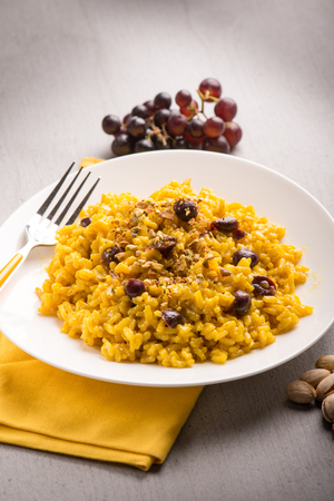 Risotto with saffron grape and pistachio nut, selective focusの写真素材