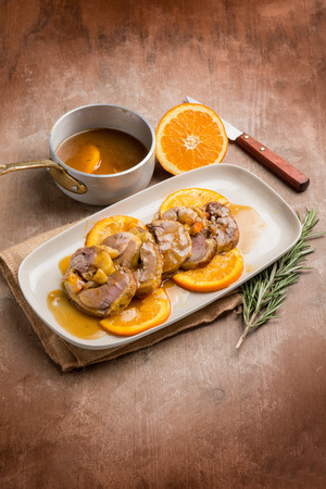 sliced duck with orange sauceの写真素材