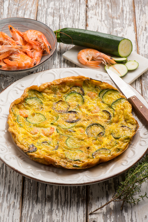 omelette with shrimp and zucchinisの写真素材