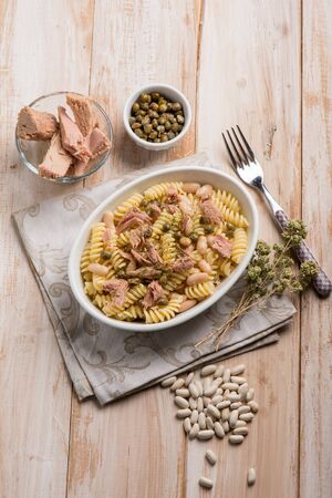 pasta with tuna white beans capers and oreganoの写真素材