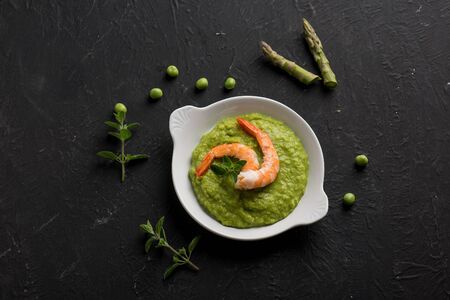 asparagus and green peas cream with shrimpの写真素材