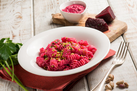 pasta with beet pesto and pistachio nutsの写真素材