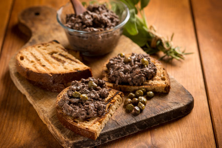 Italian canape with liver pate over wood tableの写真素材