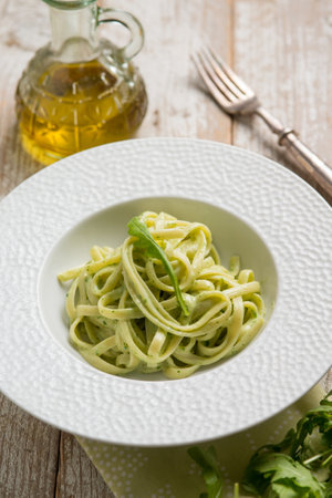 linguine pasta with arugula pestoの写真素材