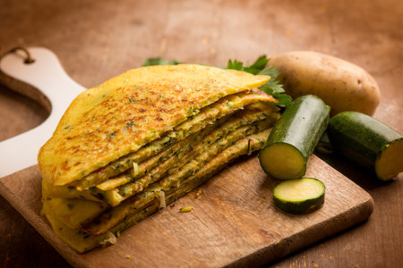 zucchini potatoes homemade crepes over cutting boardの写真素材