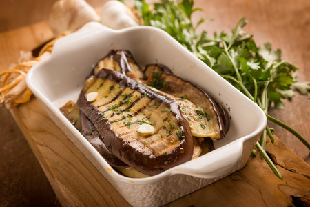 grilled eggplants with garlic parsley and olive oilの写真素材