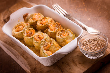 prawn zucchini rolls witn mozzarella and sesame seedsの写真素材