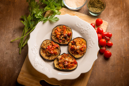 oven grated eggplants with fresh tomatoes and cheeseの写真素材
