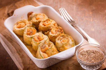 prawn zucchini rolls witn mozzarella and sesame seedsの写真素材