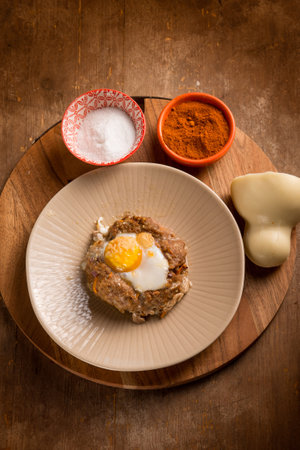 minced meat nest with scamorza cheese and eggの写真素材