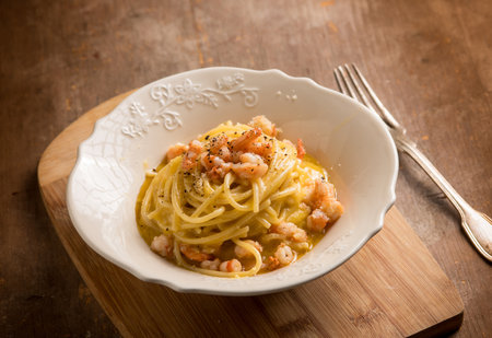 spaghetti carbonara with prawnsの写真素材