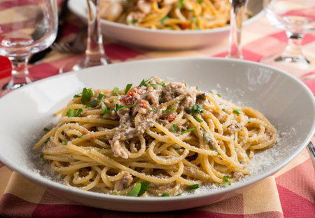 spaghetti with anchovies fresh tomatoes and parsleyの写真素材