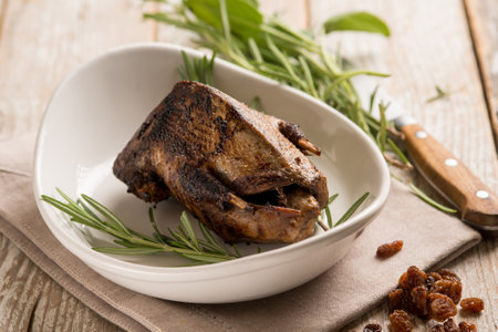 roasted pigeon with dried grape and rosemaryの写真素材