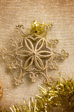 gold christmas decoration over gold backgroundの写真素材