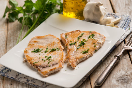 grilled swordfish with garlic and parsleyの写真素材