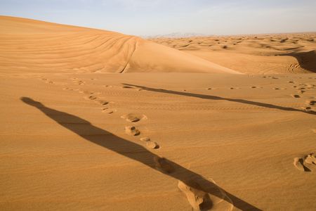 Landscape od Dubai desert with two human shadows.の写真素材