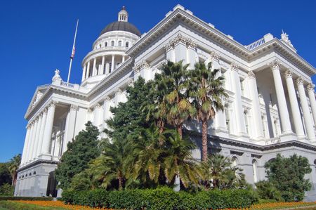 The California State Capitol Building in Sacramento, flag flying at half mast.の写真素材