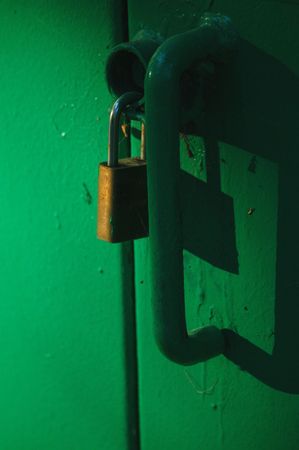 Lock and key in partial shadowの写真素材