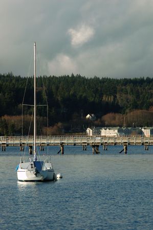 sailboat at anchor in the harbor