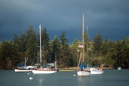 Boats in the harbor on a stormy afternoonの写真素材