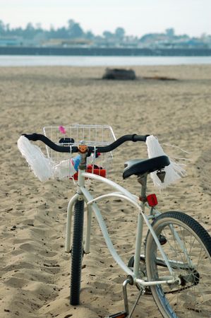bicycle lying on the beach in Santa Cruz, Californiaの写真素材