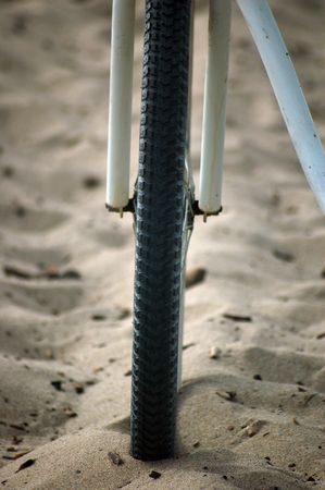 bicycle lying on the beach in Santa Cruz, Californiaの写真素材