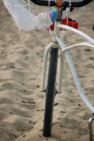bicycle lying on the beach in Santa Cruz, Californiaの写真素材