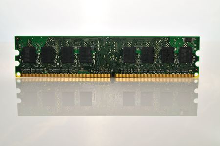 computer memory chip on a white reflective backgroundの写真素材