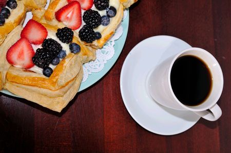 delicious berry custard cakes with blackberries blueberries and strawberriesの写真素材
