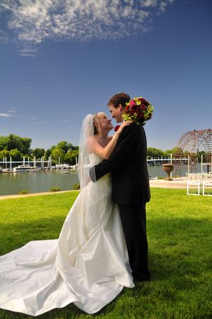 newly wed bride and groom admiring the view on thier wedding dayの写真素材