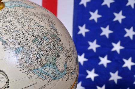 Globe with the USA and US flag backgroundの写真素材