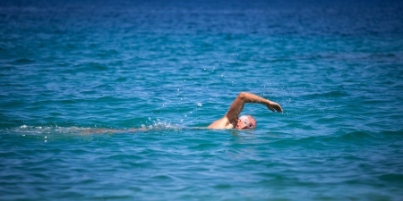 senior swimmer at seaの写真素材