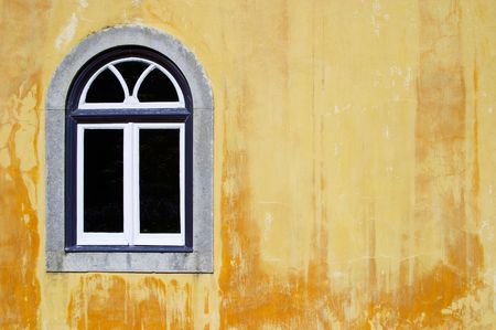 Traditional window on yellow background wall in the sun, Sintra, Lisbon, Portugalの写真素材