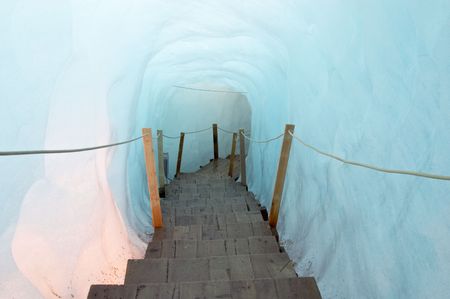 Footbridge inside the ice cave (Eisgrotte am Rhonegletscher) on Furka Pass, Alps, Valais, Switzerlandの写真素材