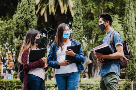 mexican students wearing mask face to prevent infection or respiratory illness, Latin People with Protection against contagious coronavirus in Mexico or Latin Americaの写真素材