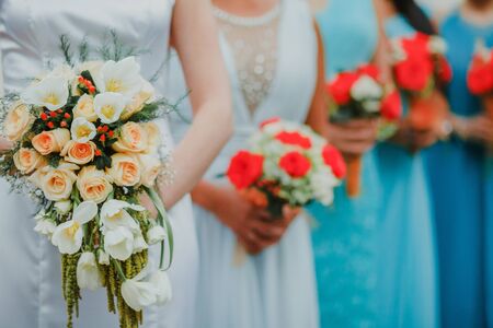 mexican Wedding bouquet of flowers in the hands of the bride and bridesmaids in mexico cityの写真素材