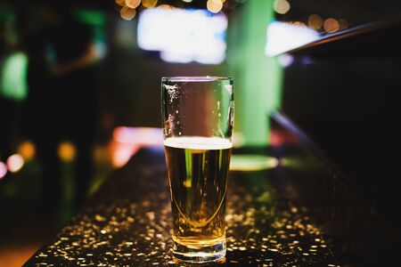 Glass of beer in bar, Draft Beer Promo in pubの写真素材
