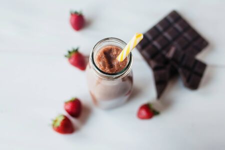 smoothie chocolate with strawberry or milkshakes, natural and organic drink in the glass jarの写真素材