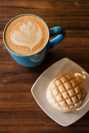 coffee cup and concha mexican bread for a breakfast in mexico city top view
