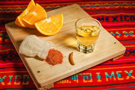 mezcal shot with chili salt and agave worm, mexican drink in mexicoの写真素材