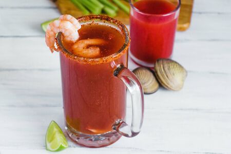 Michelada beer with tomato juice, clam and lemon, mexican drink cocktail in mexicoの写真素材