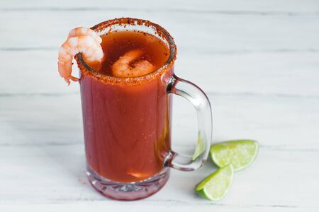 Michelada beer with tomato juice, clam and lemon, mexican drink cocktail in mexicoの写真素材