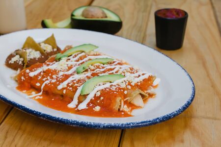 red enchiladas mexican food with tomato sauce and cheese in mexicoの写真素材