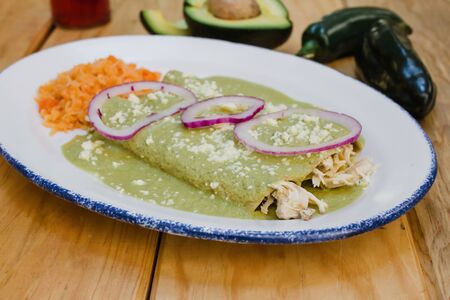green enchiladas mexican food with tomato sauce and cheese in mexicoの写真素材